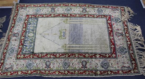 A Panderma part silk pale green/grey ground prayer rug, 5ft 4in by 3ft 6in.